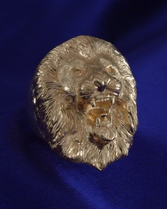 Hand engraved gold lions head ring