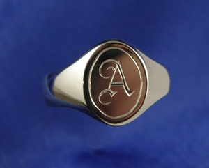 Hand engraved gold signet ring